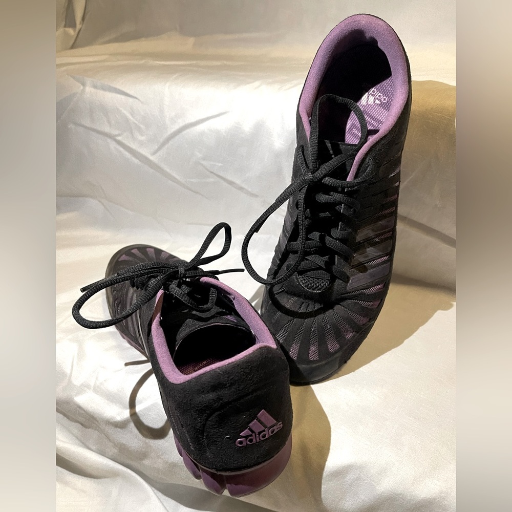 Unique purple adidas tennis shoes.